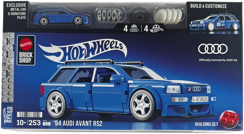 Box packaging for a Hot Wheels Brick Shop building set featuring a blue 1994 Audi Avant RS2 model car. The front of the box shows the assembled blue car, the Hot Wheels logo, the Mattel Brick Shop logo, an Audi logo, and a small preview of included metal car parts at the top.