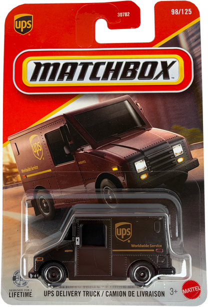 Matchbox Mattel 98/125 UPS Delivery Truck diecast toy car in its original blister card packaging, featuring a dark brown truck with gold UPS branding.