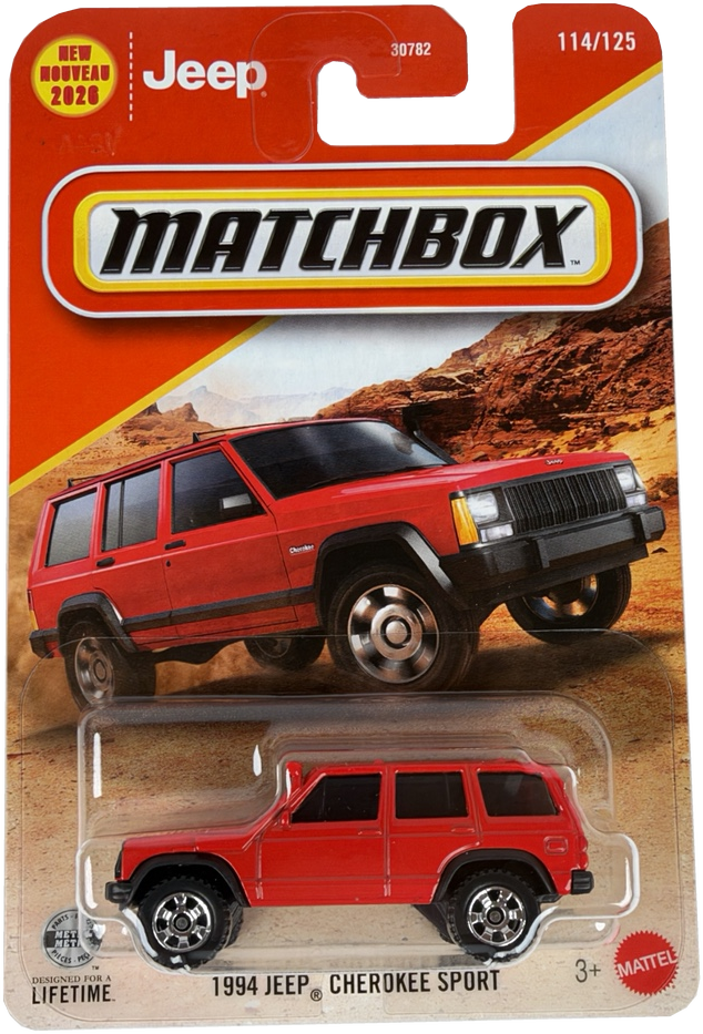 Matchbox diecast toy car of a 1994 Jeep Cherokee Sport in red, in its original blister card packaging. The packaging features a red and yellow header card with the Matchbox logo and a printed image of the red vehicle on a desert background.