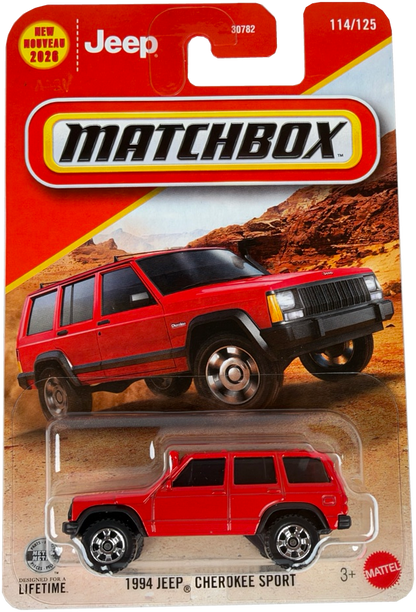 Matchbox diecast toy car of a 1994 Jeep Cherokee Sport in red, in its original blister card packaging. The packaging features a red and yellow header card with the Matchbox logo and a printed image of the red vehicle on a desert background.
