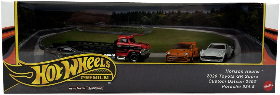 Hot Wheels Premimum Track Day Diorama display, a black, white, and red cardboard display showing 4 vehicles on a race track background.