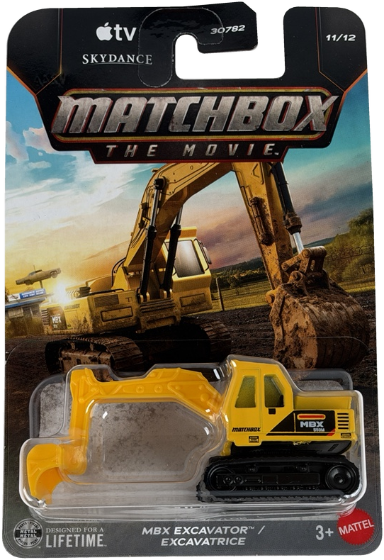 Matchbox The Movie MBX Excavator toy in its original blister card packaging, featuring a yellow and black excavator with a construction site background on the card.