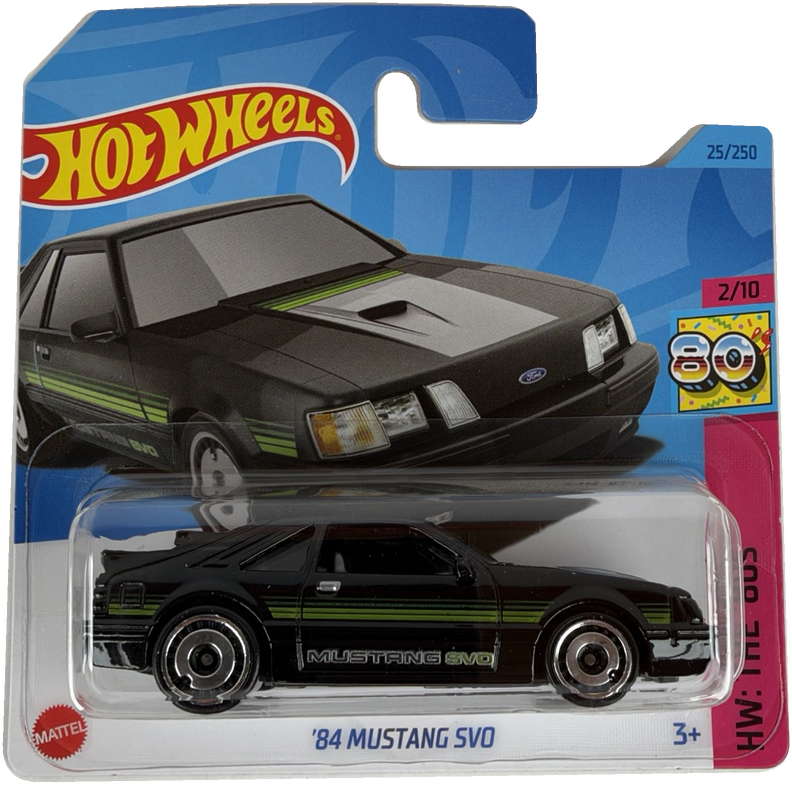 Hot Wheels '84 Mustang SVO diecast toy car in its original blister packaging, featuring a black car with green and white stripes on a blue and white card.