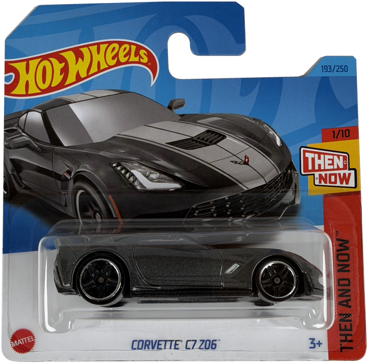 Hot Wheels Mattel then and now Corvette C7 206 diecast toy car in its original blister card packaging, featuring a dark gray car with white racing stripes.