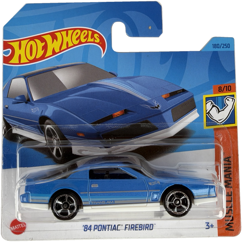 Hot Wheels Muscle Mania '84 Pontiac Firebird die-cast toy car in its original blister packaging, featuring a blue car with white racing stripes.