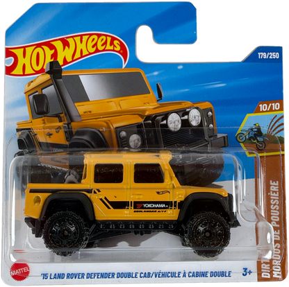 Hot Wheels die-cast toy vehicle package featuring a yellow and black '15 Land Rover Defender Double Cab. Diecast truck is displayed in front of a printed illustration of the same vehicle on a blue and white blister card with Hot Wheels branding.